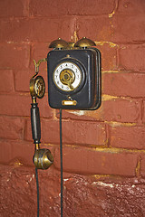 Image showing Old phone on the wall