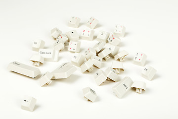 Image showing scattered keyboard keys on white 