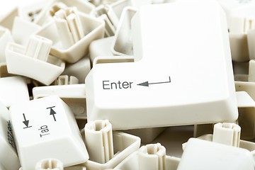 Image showing scattered keyboard keys on white 