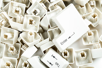 Image showing scattered keyboard keys on white 