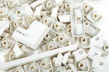 Image showing scattered keyboard keys on white 