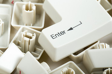 Image showing scattered keyboard keys on white 