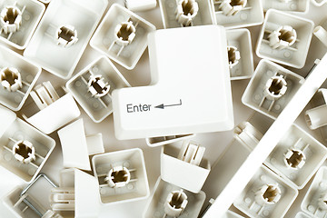 Image showing scattered keyboard keys on white 