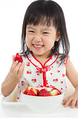 Image showing Asian Chinese little girl eating strawberries