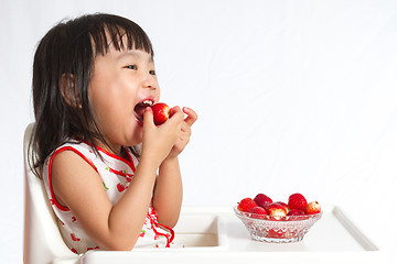 Image showing Asian Chinese little girl eating strawberries