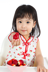 Image showing Asian Chinese little girl eating strawberries