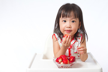 Image showing Asian Chinese little girl eating strawberries