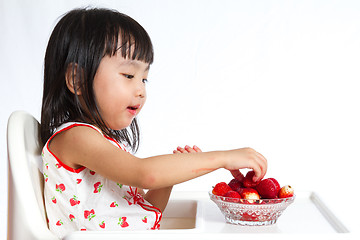 Image showing Asian Chinese little girl eating strawberries