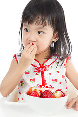 Image showing Asian Chinese little girl eating strawberries