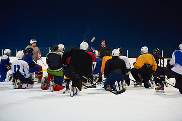 Image showing ice hockey players team meeting with trainer