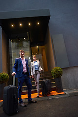 Image showing business people couple entering  hotel