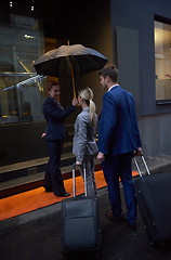 Image showing business people couple entering  hotel