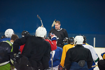 Image showing ice hockey players team meeting with trainer