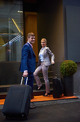 Image showing business people couple entering  hotel