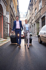 Image showing business people couple entering  hotel