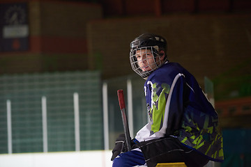 Image showing ice hockey players on bench