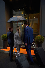 Image showing business people couple entering  hotel