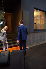 Image showing business people couple entering  hotel