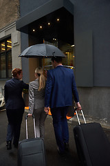 Image showing business people couple entering  hotel