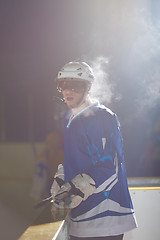 Image showing ice hockey players on bench