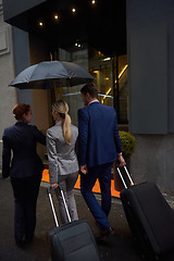 Image showing business people couple entering  hotel