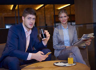 Image showing business couple take drink after work