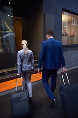 Image showing business people couple entering  hotel