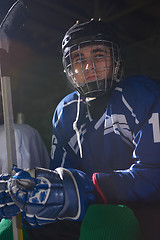 Image showing ice hockey players on bench