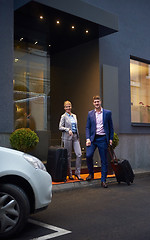 Image showing business people couple entering  hotel