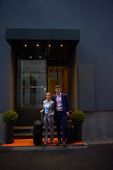 Image showing business people couple entering  hotel