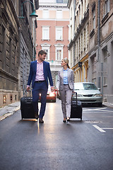 Image showing business people couple entering  hotel