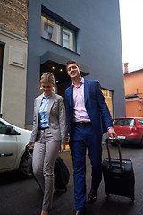 Image showing business people couple entering  hotel