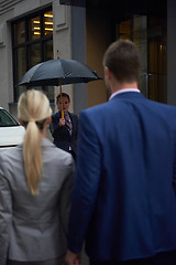 Image showing business people couple entering  hotel