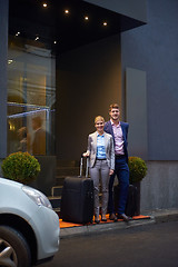 Image showing business people couple entering  hotel