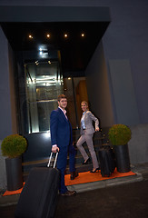 Image showing business people couple entering  hotel