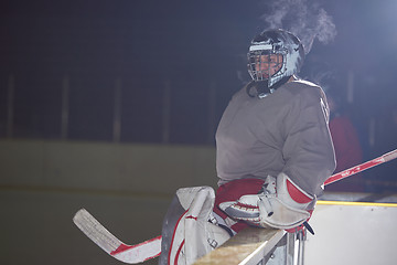 Image showing ice hockey players on bench