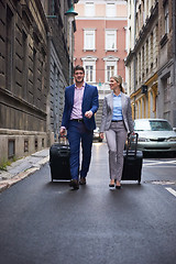 Image showing business people couple entering  hotel