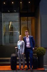 Image showing business people couple entering  hotel