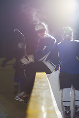 Image showing ice hockey players on bench