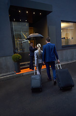 Image showing business people couple entering  hotel