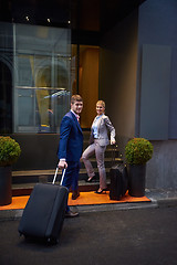 Image showing business people couple entering  hotel