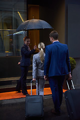 Image showing business people couple entering  hotel