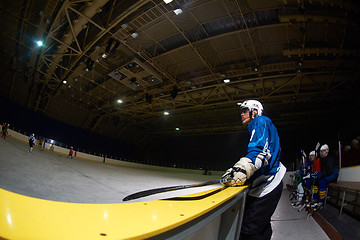 Image showing ice hockey players on bench