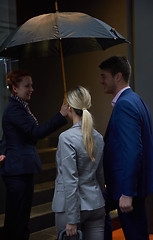 Image showing business people couple entering  hotel