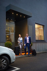 Image showing business people couple entering  hotel