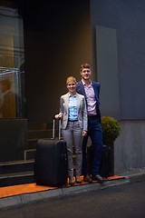 Image showing business people couple entering  hotel