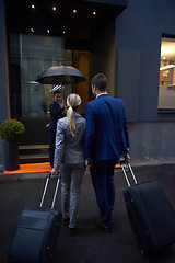 Image showing business people couple entering  hotel