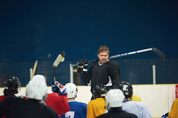 Image showing ice hockey players team meeting with trainer