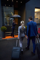 Image showing business people couple entering  hotel