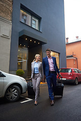 Image showing business people couple entering  hotel